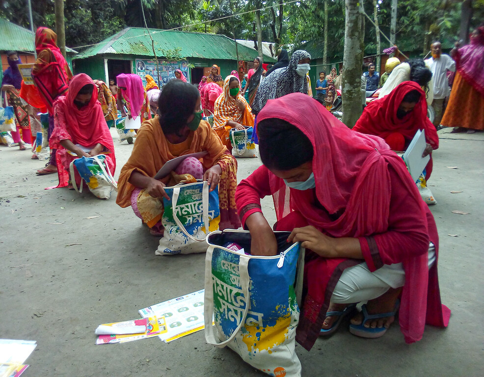 an adolescent girls receive UNFPA menstrual health management kits