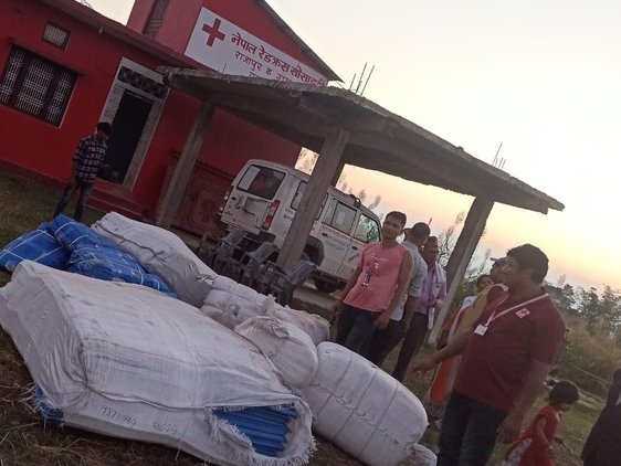 Preparing tarpaulins stocks for use as temporary shelters. © Nepal Red Cross Society