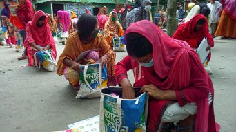an adolescent girls receive UNFPA menstrual health management kits